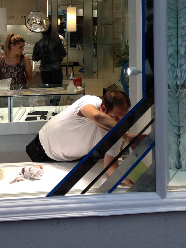 A picture of a person installing window graphics
